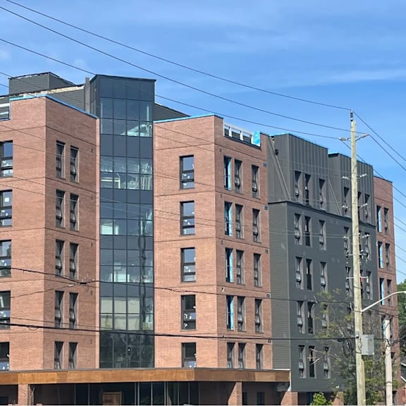 a city building with a blue sky in the background