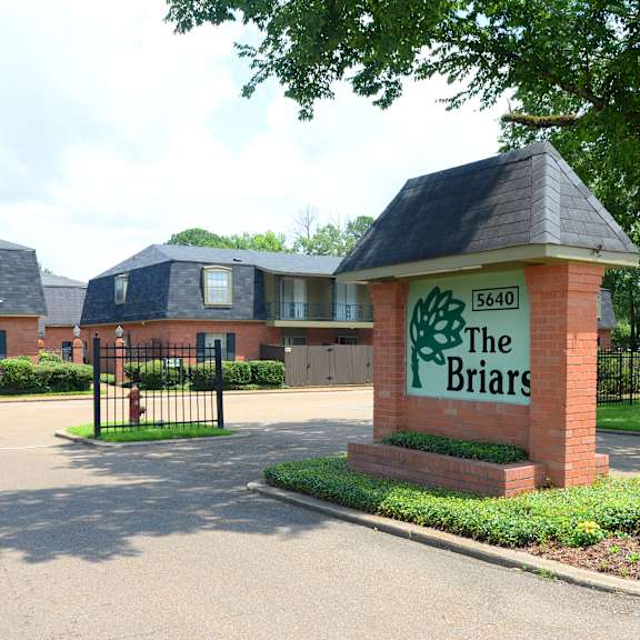 the briars is a residential complex with brick buildings and a gated entrance.
