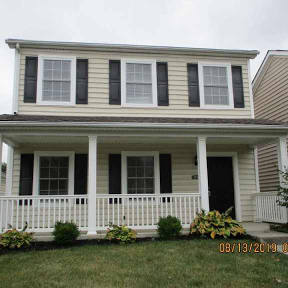a picture of a house with a front porch