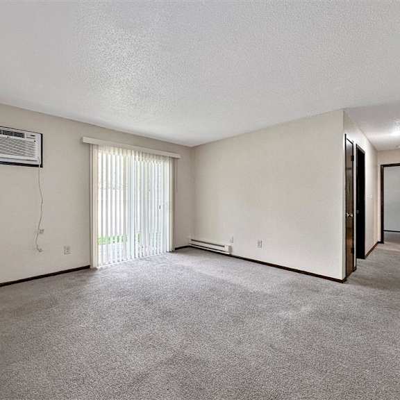 the living room of a house with graffiti on the wall
