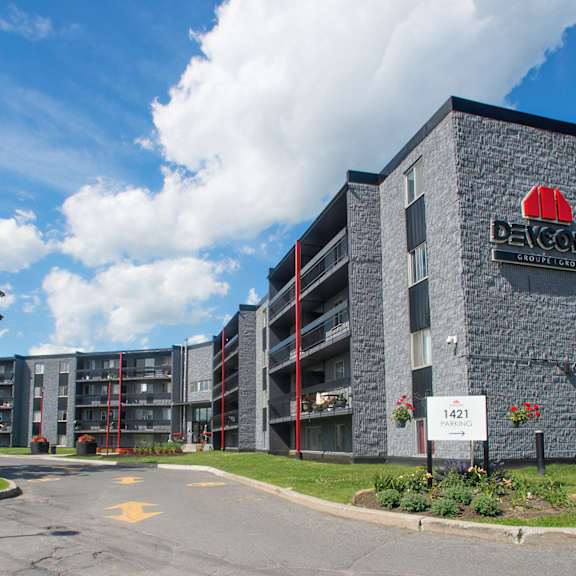 a large building with a red sign on it that says "bayshore".
