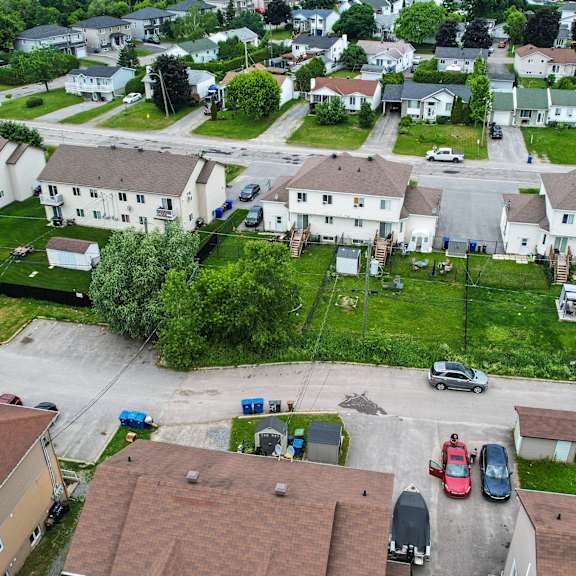 a residential area with houses and cars.