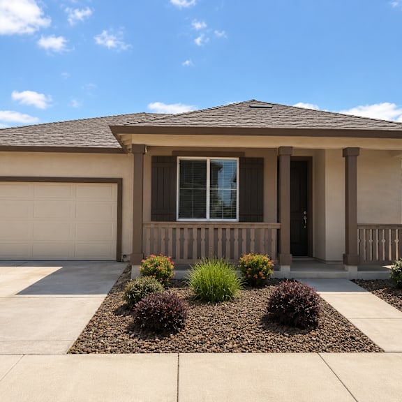 a house with a brown roof and a white garage door.