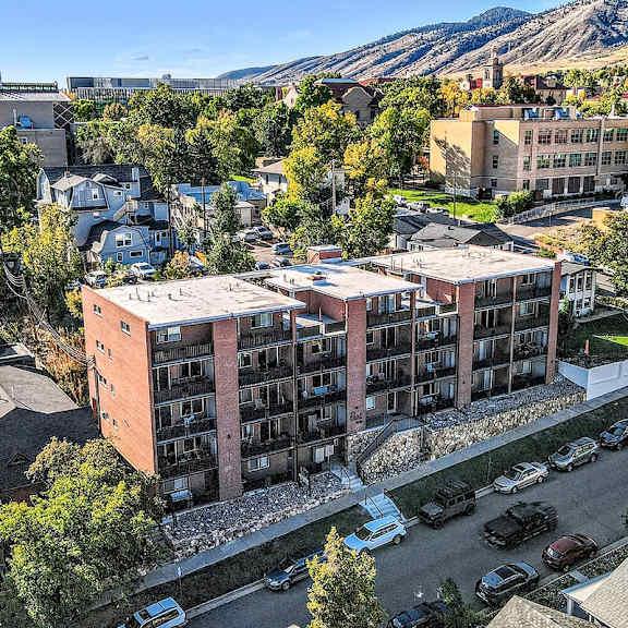 a view of a town with a large building in the middle.