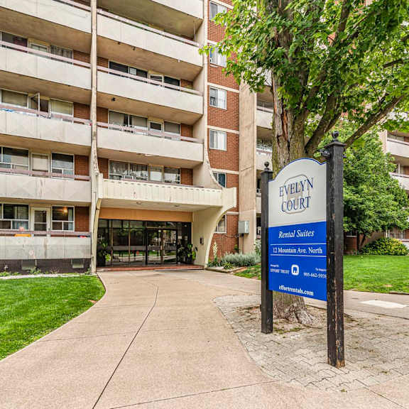 a sign for evelyn court is in front of a building.