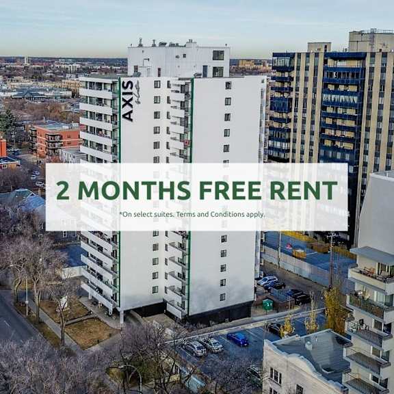 a cityscape with apartment buildings and a sign offering 2 months free rent.