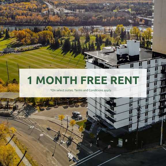 a large building with a sign offering a free one month rent.