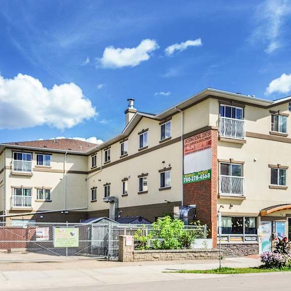 a large building with a sign that says "residencies" in front of it.