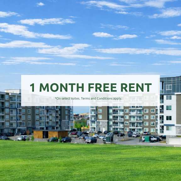 a sign offering a free one month rent is displayed in front of apartment buildings.