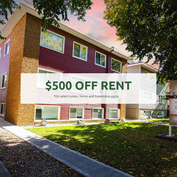 a building with a sign that says "$500 off rent" in front of it.