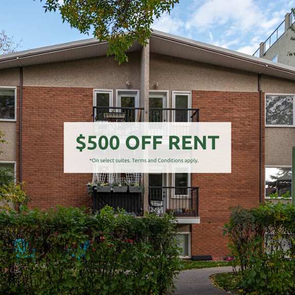 a brick building with a sign that says "$500 off rent" in front of it.