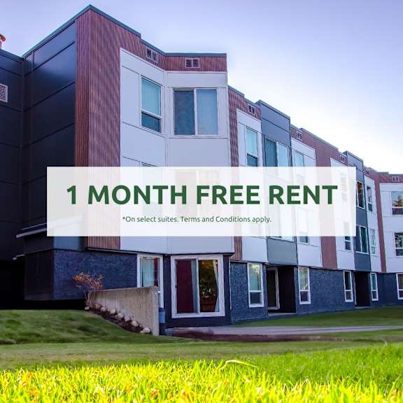 a modern building with a sign offering a free one month rent.