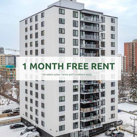 a tall white building with a sign that reads "1 month free rent".