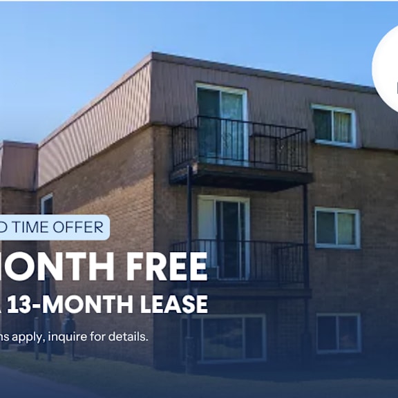 a building with a sign offering a free month on a 13-month lease.