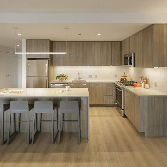 a modern kitchen with a dining table and chairs.