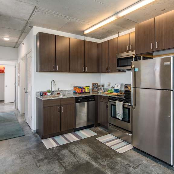 a kitchen with a refrigerator on the right side.