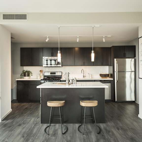a modern kitchen with black and white decor.