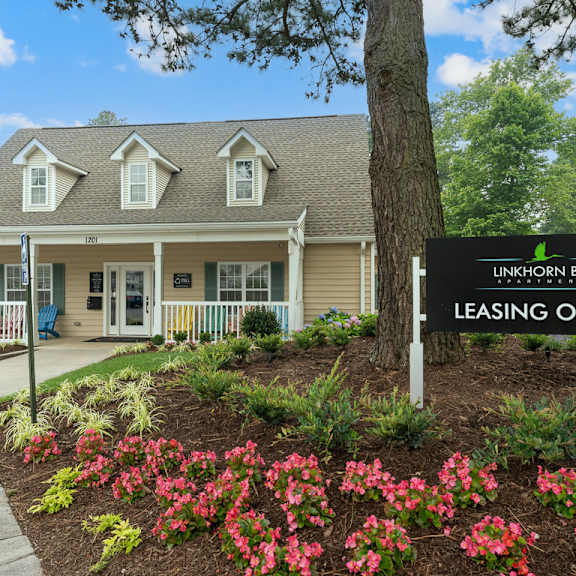 a building with a leasing office sign in front of it at linkhorn bay apartments, virginia beach, virginia