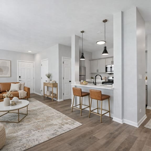 A modern kitchen with a large island and stainless steel appliances.