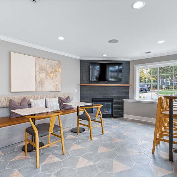 A modern living room with a fireplace and a television.