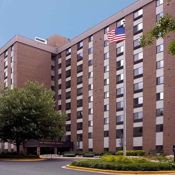 a large brick building with an flag in front of it
