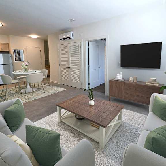 a living room with a grey couch and a wooden coffee table.