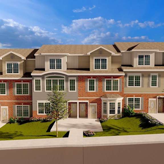 a large, multi-story residential building with a brick facade and multiple windows.