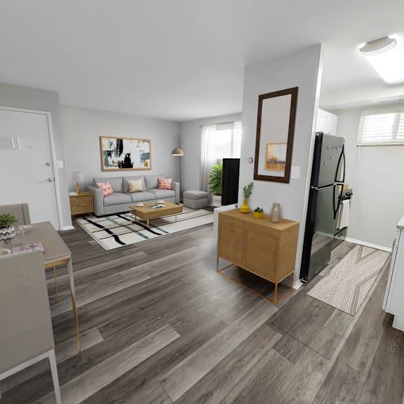 a spacious living room with hardwood flooring and white walls