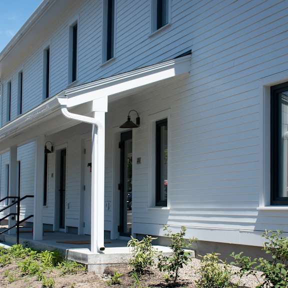 a view of the front porch of a white house
