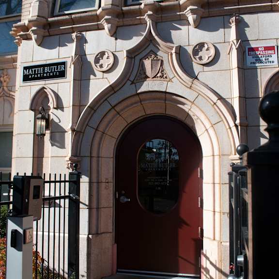 the front of a building with a red door