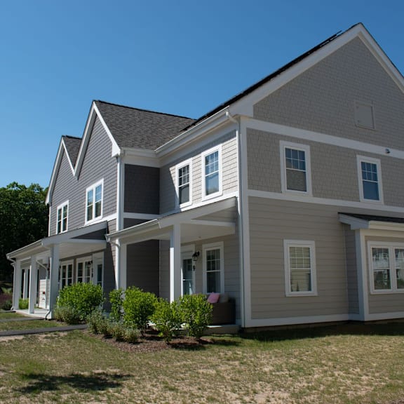 a large house with a grassy area in front of it