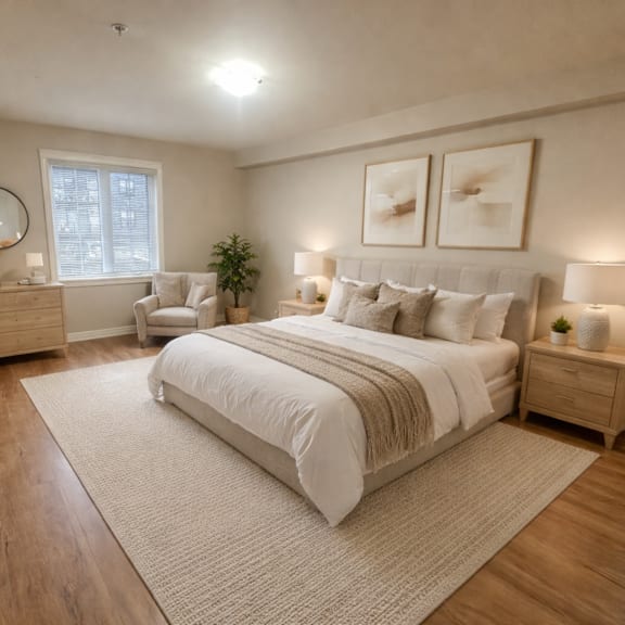 a bedroom with a large bed, a chair, and a potted plant.