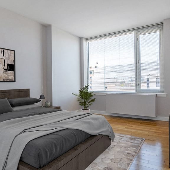 a bedroom with a bed and a large window at 34 Berry, Brooklyn, New York