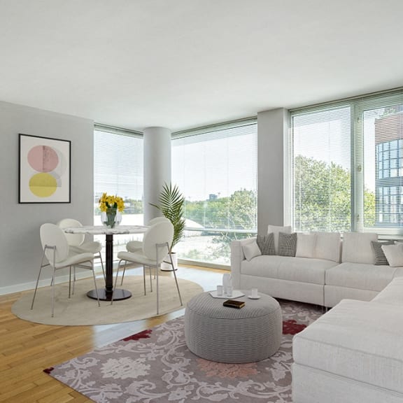 a living room with a white couch and a table with chairs at 34 Berry, Brooklyn, NY, 11249