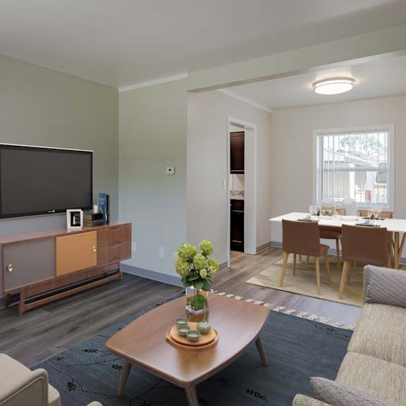 a living room with a couch and a table and a television
