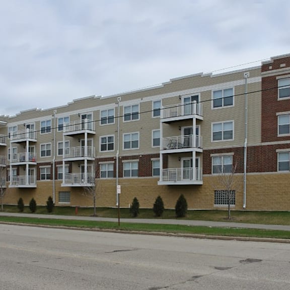 an apartment building on the side of a street