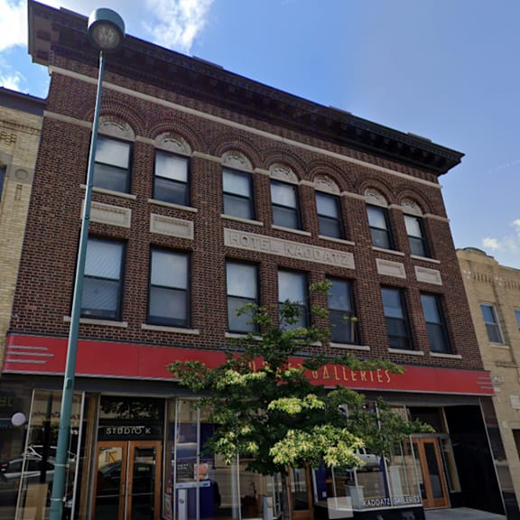 a building with a red awning that says "galleries" on it.