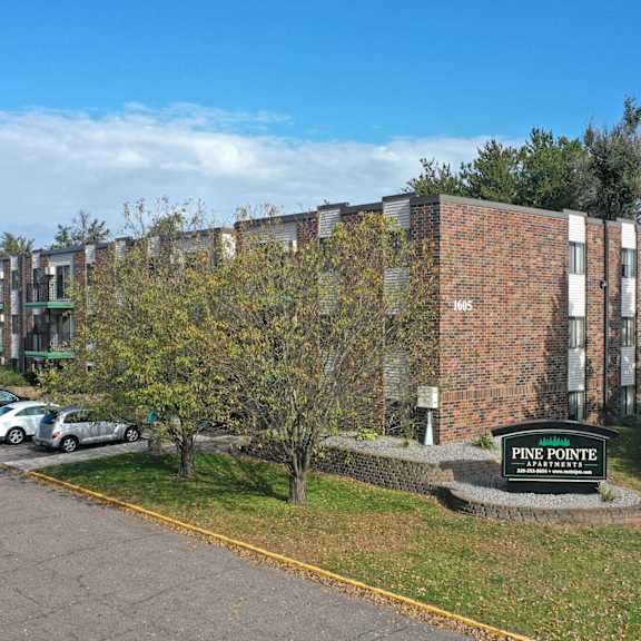 a parking lot in front of a pine pointe building.