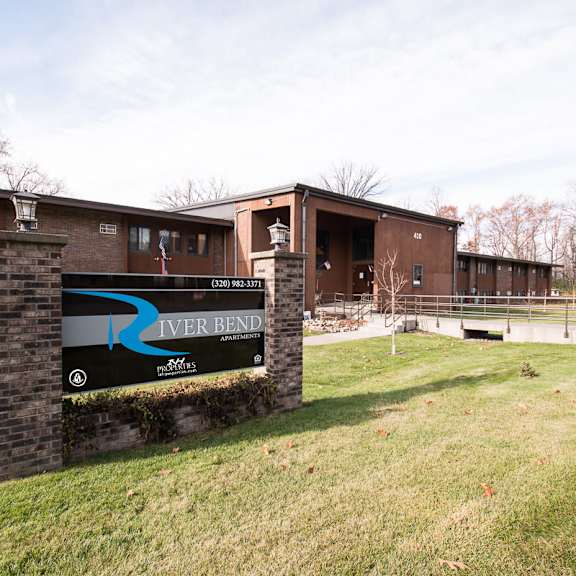 a sign for river bend is in front of a building.
