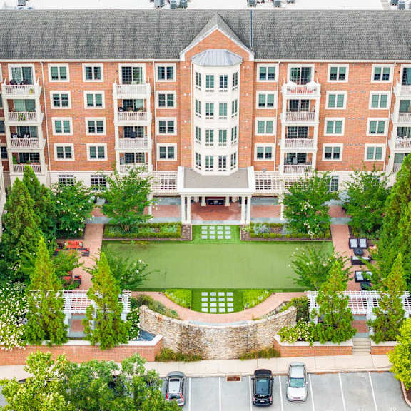 a large brick building with a courtyard in the middle.