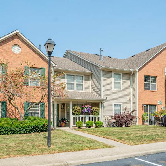a row of houses with a sidewalk in front of them