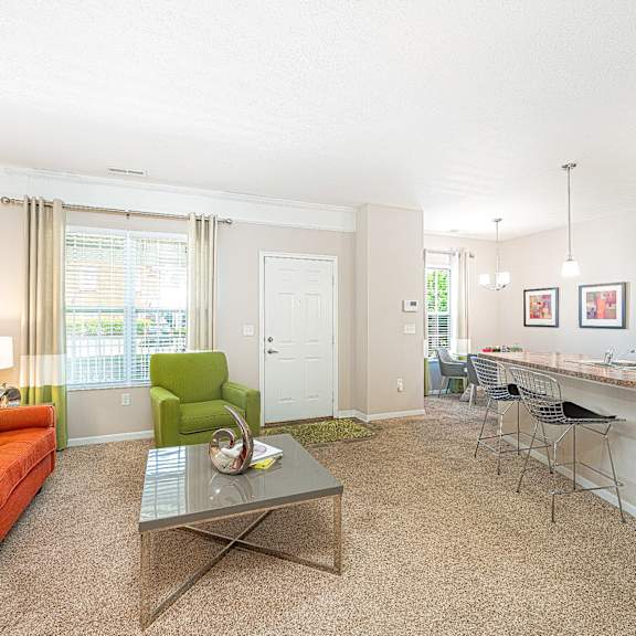 a living room with an orange couch