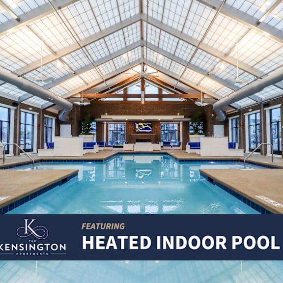a heated indoor pool with a glass ceiling