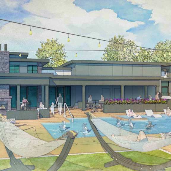 a modern house with a pool and lounge chairs.