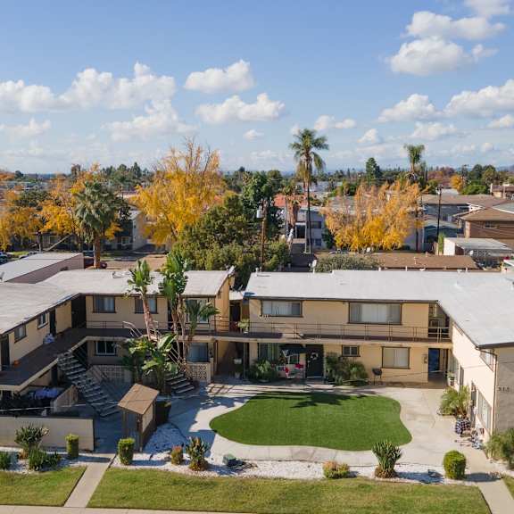 a large apartment complex with a courtyard in the middle.