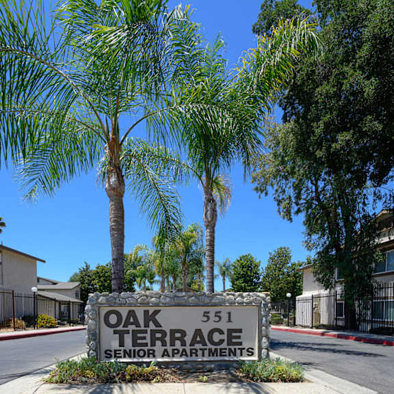 a sign that says oak terrace senior apartments at oak terrace senior apts, california