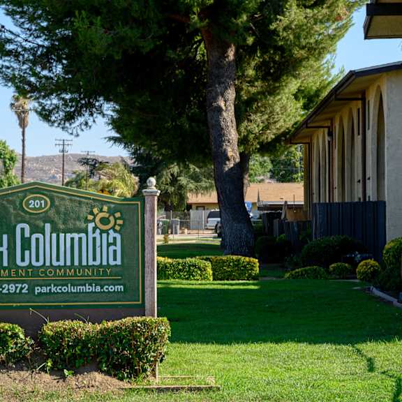 a sign in front of a building at park columbia apts, california, 92544