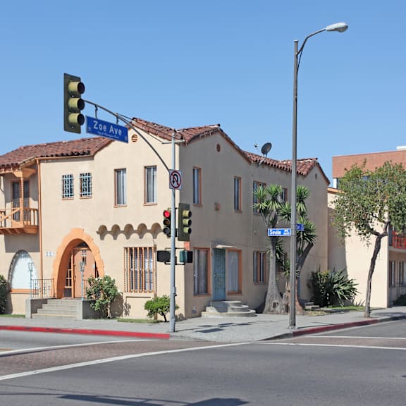 a street view of a building with a green traffic light.