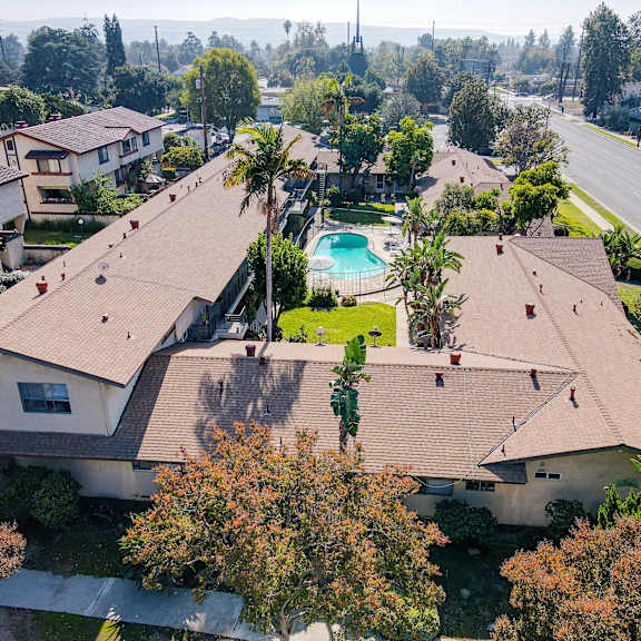 a residential area with houses and a pool.