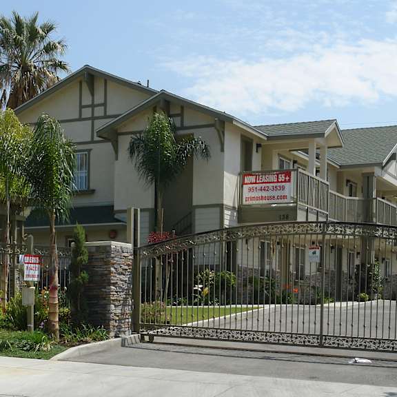 a gated community with a sign that says "new home open house".